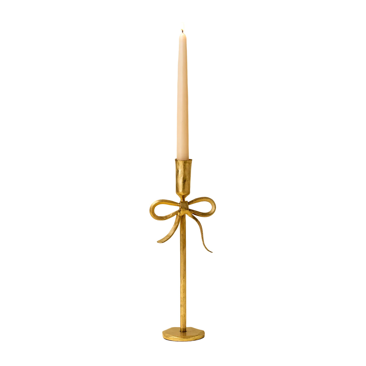 Gold candle holder with a bow design on a beige background