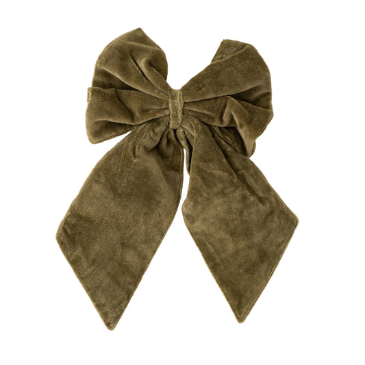 Brown velvet bow on a beige background